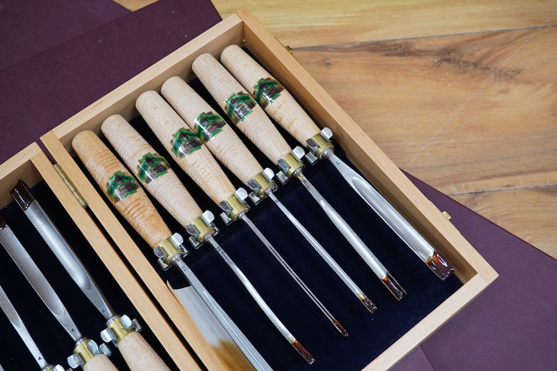 Three sets of Henry Taylor Tools Limited of Sheffield, wood carving chisels, comprising of a 12-carving chisel set contained within a fitted beech case, a set of 17 skew gouges in a fitted card case, and a set of 12 micr